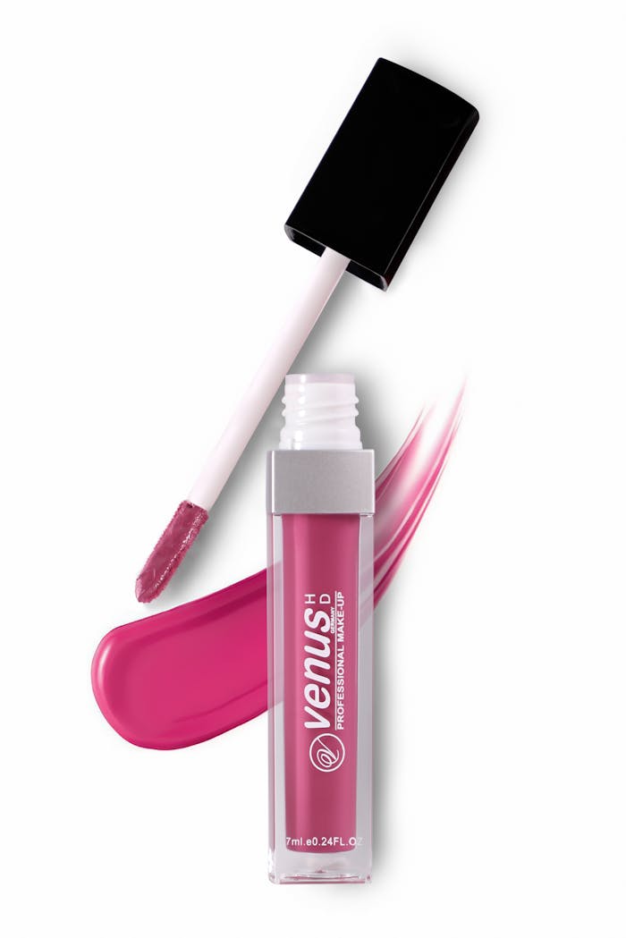 our-journey-03 Close-up of pink lipstick with applicator and swatch, highlighting its vibrant shade.